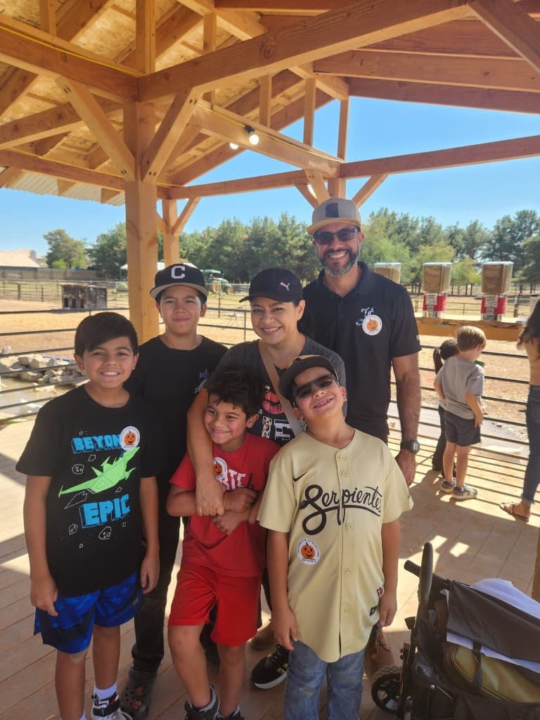 Community Schoolhouse students and adults gathered together outdoors.