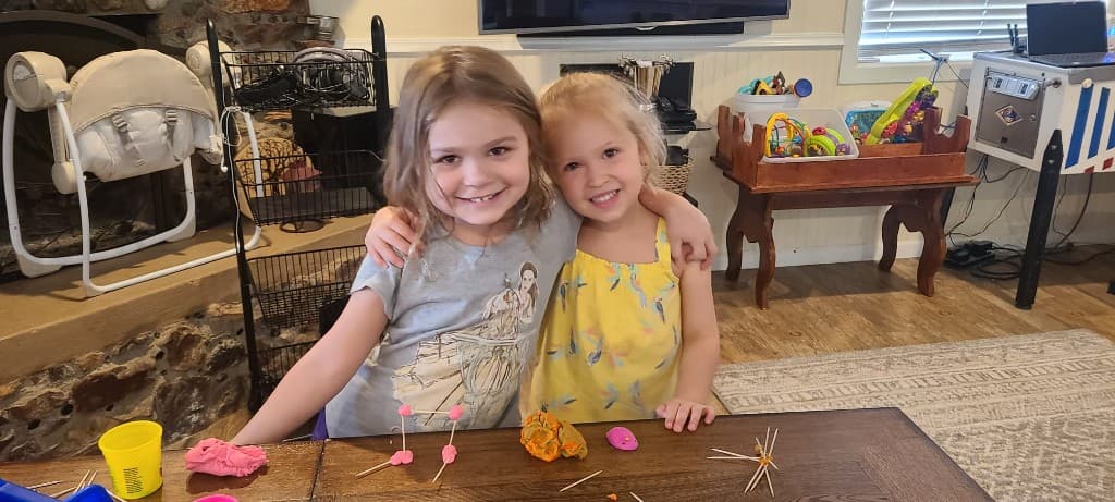 Two smiling students at Community Schoolhouse.